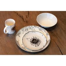 A knife or butter spreader on the right side of the plate and a fork on the left side. These Harry Potter Dishes Will Step Up Your Table Setting