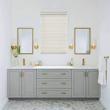 The blue floor tiles are in total contrast with the whiteness of the tub. White And Gold Bathroom Ideas Houzz