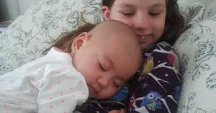 We just had this love for her': Family adopts Chinese baby with cancer