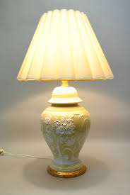 This beautiful porcelain and brass stiffel lamp is in excellent condition. Vintage Oversized Ceramic Lamp In Pale Gold With Raised Floral Design In White Leffler S Antiques