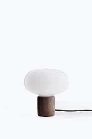 The shape of the lamp its inspired from the organic shape of a mushroom. New Works Karl Johan Table Lamp Smoked Oak Von Goodform Ch