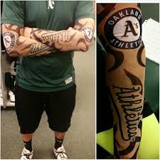 Awesome oakland raiders logo tattoo on right side rib. Nick Rickles On Twitter Covered Up All My Tattoos With Oakland Athletics Symbols Just Kidding But These Tattoo Sleeves Look Pretty Real Http T Co Ckllaniuja