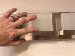I spent a few months replacing cabinets and vanities in homes that were gutted after hurricane katrina. How To Install A Vanity Light Fixture Letsfixitup Com
