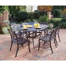 Homestyles Biscayne Bronze 7 Piece Patio Dining Set 5555 338 The Home Depot In 2020 Outdoor Patio Furniture Sets Outdoor Patio Space Wrought Iron Patio Set