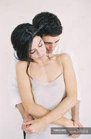 In other words, for the sake of social etiquette. Man Hugging Woman And Holding Hands Bedroom Scene Caucasian Stock Photo 156599190