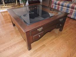 A tempered glass inset top reveals a display drawer to showcase the treasured collection. Glass Top Coffee Table Display Case Manger Auctions Estate Sales