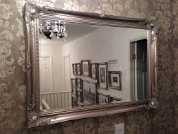 Mirror Large Decorative Mirrors With A Wall Using Wallpaper Looks Like Something Flirty The Large Dec Mirror Wall Bedroom Fancy Mirrors Mirror Wall Living Room