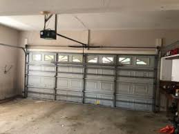 Inside The Garage A Before And After Garage Door Specialist Lots Of Neighbors Used They Have In 2020 Garage Doors Garage Door Design Garage Door Panels