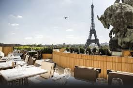 Cafe De L Homme Dining With A Tower View Best Honeymoon Locations Best Rooftop Bars Honeymoon Locations