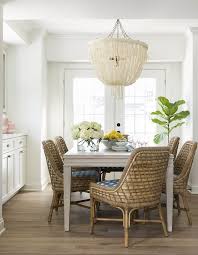 Coastal Relaxed Dining Room With Rattan Dining Chairs Pole Rattan Frame And Legs In Natural Seagrass Woven Dining Chairs Dining Room Design Coastal Dining Room