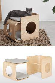 In the cardboard buildings a different take on the cat carrier: A Stylish Wooden Cat Bed Made From Wood With Grey Cushions Catbed Petbed Petaccessories Kittenskink Pet Furniture Cat Furniture Design Cat Furniture