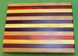 Our cutting boards utilize the face grain of the wood which is why they are put together with longer strips grain. Exotic Hardwood Cutting Board 984