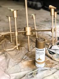 A smooth foam roller can be used to avoid brushstrokes on flat areas of the metal object. Chandelier Makeover The Best Brass Spray Paint Bless Er House