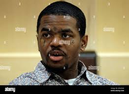 Suspected shooting accomplice Dedrick Williams speaks to someone in the  courtroom gallery as attorneys meet with Judge Michael Usan for a sidebar  discussion during closing arguments in the XXXTentacion murder trial at