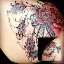 Blue hummingbird tattoo with flowers on the chest of man. 61 Matchless Lace Shoulder Tattoo Designs