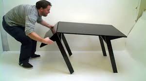 Sold by duffy london, it uses a clever combination of hinged panels that fold in and fold out to achieve the transforming effect. Mk1 Transforming Coffee Table Video Dailymotion