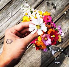 His first tattoo done in may of 2007 is actually his first and second tattoos. G Dragon Smiley