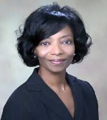 Brown is first African American woman to sit