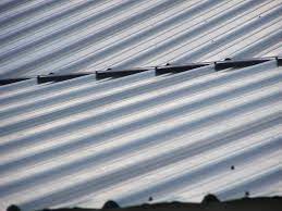 * always wear safety goggles or glasses when cutting or drilling metal panels. Transition Trim For Metal Roof Pitch Change