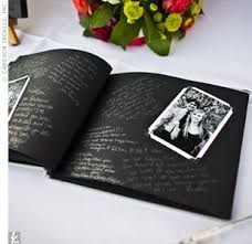 The Guest Book A Guest Book With Black And White Photos Guests Wrote A Note To The Couple With A Silver Ink P Wedding Guest Book Photo Guest Book Guest Book