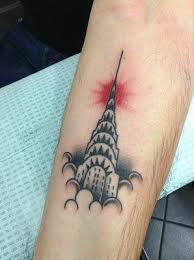 Red sign with piercing written on it. 8 Awesome Chrysler Building Tattoos Temporary Tattoo Blog