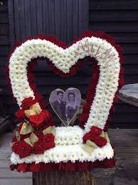 Our guide to funeral flowers provides an insight and guidance to help you choose the correct item for the occasion. Funeral Flowers Heart Funeral Flower Tribute Gates Of Heaven Heart Funeral Flower Tribute Bespoke Funeral Flowers Funeral Flower Arrangements Funeral Floral