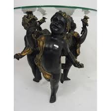 Table sculptures and figurines bring an artistic weight to your home decorating. Glass Topped Three Dancing Cherubs Coffee Table Approx 2ft High X 2ft Dia