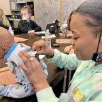 Kiski Area students learn baby basics with simulator infants