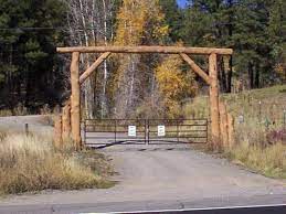 Sadly i'm running low on ideas and have resorted on asking you. Automated Gate Picture A Rustic Log Cabin Nestled On A Wooded Hillside At The End Of This Winding Country Farm Entrance Farm Gate Gate Entrance Ideas Ranch