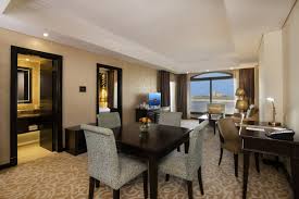 A rug centered beneath the table, a centerpiece on top of the table, and perhaps some wall art or a wall mirror! Marjan Island Resort Spa 0c9a0254hd