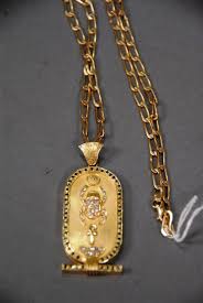 Realized Price 2 530 00 18k 20k Gold Chain With Large Egyptian Style Pendant Set With 54 Emeralds And 26 Diamonds Length Of Pendant Set Gold Chains Gold