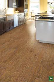 Create A Cozy Atmosphere In Your Home With Shaw Encore Laminate Flooring Adorned In A Carolina Hickory Finish This Gorgeous Floo Wood Look Tile Flooring Kitchen Flooring