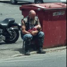 The biker cut off his own club's patches to wrap a freezing ...