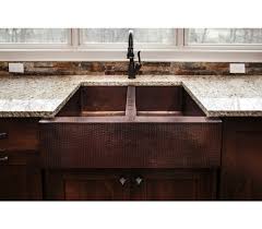 Although farmhouse sinks, also called apron or apron front sinks, can be made from many materials, copper is a metal that acts as a beacon for discerning buyers. Artisan Copper Farmhouse Double Bowl
