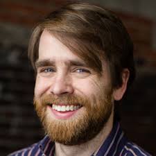 PERI faculty members (from left) Steven Sprick Schuster, Daniel Smith, and  Ennio Piano celebrate PERI Fellow Protik Nandy's suc