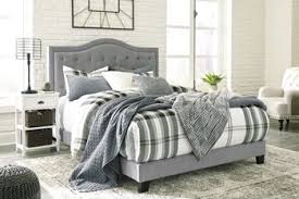 While wooden side rails add a rich mahogany color to the piece, diamond shaped tufting. Jerary Queen Upholstered Bed