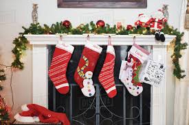 If like me, you don't have a fireplace (and don't feel like drilling holes in the walls) but you still have kids and family who love the. Christmas Stockings Hanging By Fireplace At Home Stock Photo Dissolve