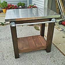 This is a pretty easy project and it creates a table grill that is perfect for your deck or backyard. 9 Brilliant Diy Outdoor Furniture Projects The Garden Glove Grill Table Diy Grill Table Diy Outdoor Furniture