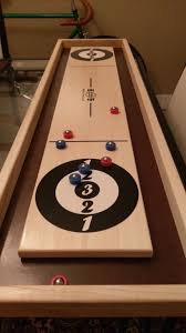How do you play shuffle board? Tabletop Shuffle Board Wooden Tabletop Game Uncommongoods Wooden Board Games Wooden Games Tabletop Games