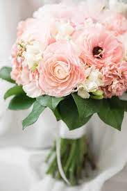 Bridal Bouquet In Pastel Colors With Ranunculus Roses Stock Carnations Freesia And Salal Flower Bouquet Wedding Flower Arrangements Carnation Flower