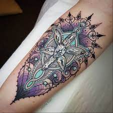 The reason i love this style of tattoos is that by itself it's still such a pretty design, someone who isn't into lotr would still appreciate it and not think wow what a weirdo getting a book/movie symbol. Tattoo Uploaded By Tattoodo Arwen S Evenstar Tattoo By Jenna Kerr Jennaker Jeweltattoos Color Ornamental Realistic Realism Jewel Crystal Pattern Linework Arwen Evenstar Lordoftherings Pearls Lace Tattoooftheday 484889 Tattoodo