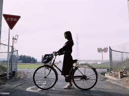 ストックフォト school girl holding a bicycle 自転車 画質 クリアランス