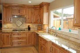 Custom Designed Kitchen With Wood Cabinets Tile Backsplash And Granite Countertops Kitchen Cabinets Light Wood Cost Of Kitchen Cabinets Kitchen Design