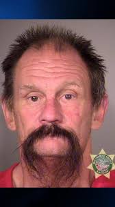 Man wearing clown mask arrested after shadow boxing outside Portland school