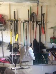 21 Ways To Make Your Mess Of A Garage So Much Better In 2020 Garden Tool Storage Garage Storage Home Improvement