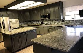 Laminate and tile flooring throughout the home for easy care. T L Granite Countertop Warehouse