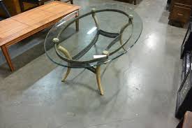 The farniente range personifies a harmony of luxury material with elegant proportions. Metal Base Oval Glass Top Coffee Table