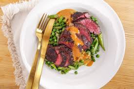 Bab.la ist für diese inhalte. Rachael S Sliced Hanger Steak With Smoky Mustard Dressing And Spring Vegetables With Shallots And Greens Recipe Rachael Ray