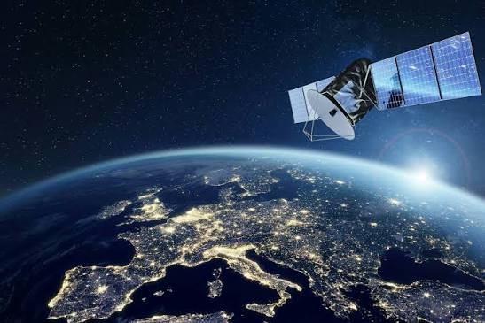 Artist rendering of the IRIS² satellite constellation in orbit above Earth.
