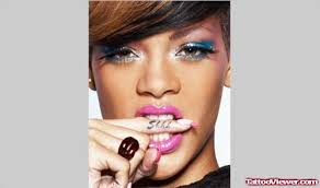 What does the sanskrit prayer on rihanna's arm mean? Rihanna Finger Tattoo For Girls